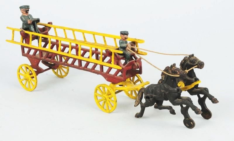 Cast Iron Horse Drawn Ladder Truck.: Contemporary. Looks to have replacement ladders. Condition (Excellent). Size 17" L.