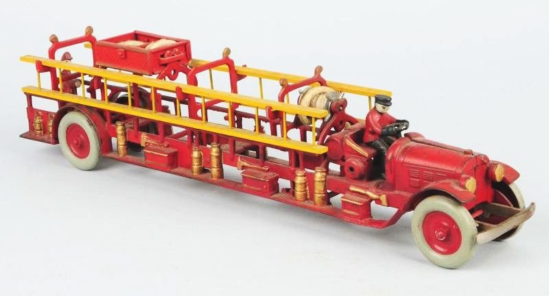 Cast Iron Ladder Truck.: This is a fantasy piece. The marriage of the back end of a horse drawn cast iron ladder truck and the front end of a fire truck. Very nice detail. Condition (Excellent). Size 22 - 1/2" L.