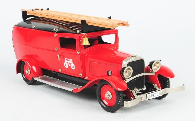 German Lehmann Pressed Steel Fire Dept. Van.: Contemporary. Clockwork. Includes two wooden ladders. Lehmann bell mark on doors. Very little wear. Condition (Excellent). Size 15" L.