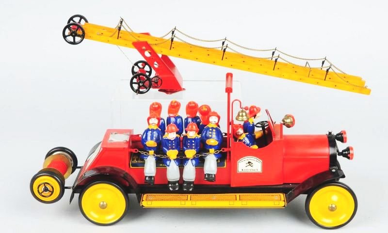 German NBM Fire Department Ladder Truck.: Contemporary. Comes with eight firemen and two drivers. Tin litho and pressed steel. Condition (Excellent). Size 20" L.