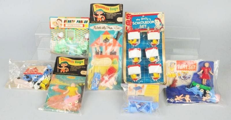 Lot of 7: Vintage Plastic Carded Toys.: Includes school sets, doll furniture sets and a train set. All are in original header carded plastic. Condition (Very Good). Size Largest Card: 13 - 1/2" x 6 - 3/4".