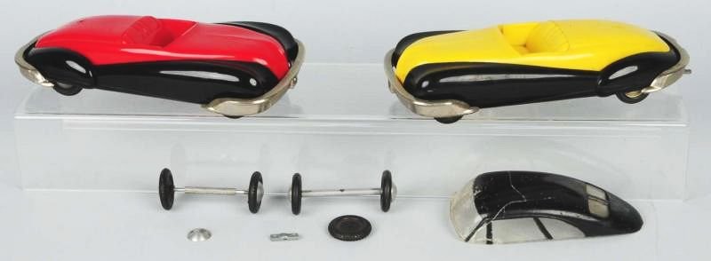 Lot of 2: Toy Founders Plastic Cars.: One is a wind up one is a push version. Both are missing some pieces and have loose pieces. Condition (Very Good). Size Each: 10 - 1/2" L.