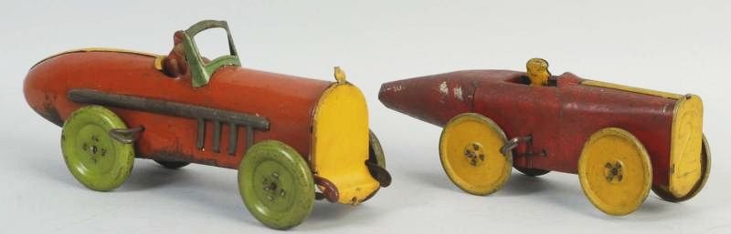 Lot of 2: Tin Wind Up Boat Tail Race Cars.: Both cars appear all original and complete. Does have significant wear and corrosion throughout. Condition (Good). Size Largest: 9 - 1/2" L.