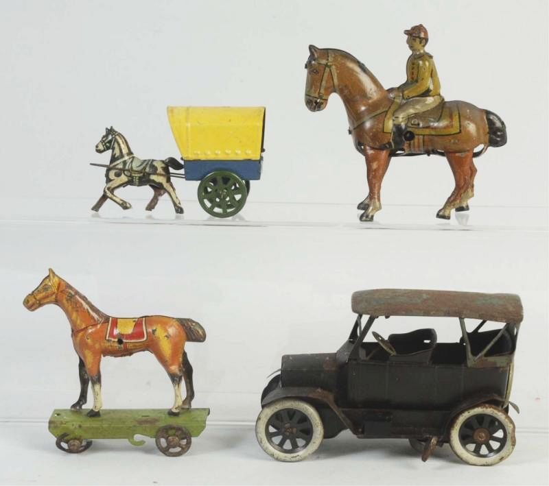 Lot of 4: Tin German Toys.: Includes a Bing Ford, a Nickeltore horse on platform, a tin wind up horse with jockey and a tin penny toy horse drawn wagon. All toys have significant scratching and wear throughout. Condition (Very G