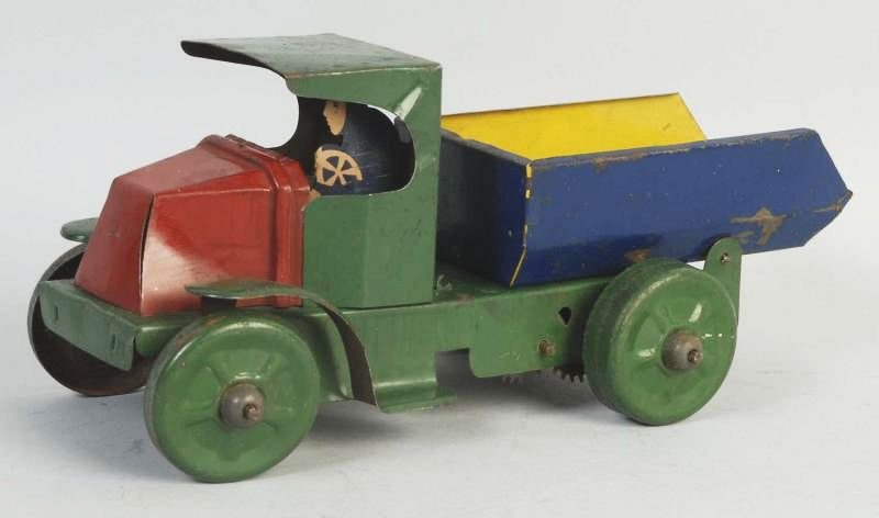 Marx Tin Wind up Bulldog Mack Series Dump Truck.: Truck appears all original. Some scratching and wear throughout. Condition (Very Good). Size 9" L.