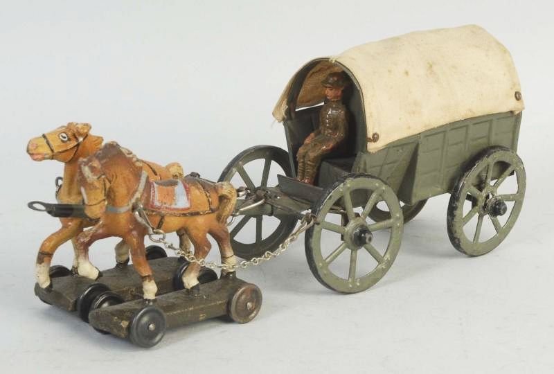 Lineol Horse-Drawn Military Covered Wagon.: Wagon is tin with two composition horses. Has original driver. All original. Condition (Very Good). Size 7 - 1/2" L.