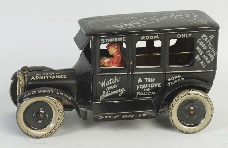 Strauss Tin Litho Wind-up Leaping Lena Toy Car.: Clever sayings written all over car. Front of car goes up and down when car is in operation. Original driver. Some wear. Condition (Very Good). Size 8" L.