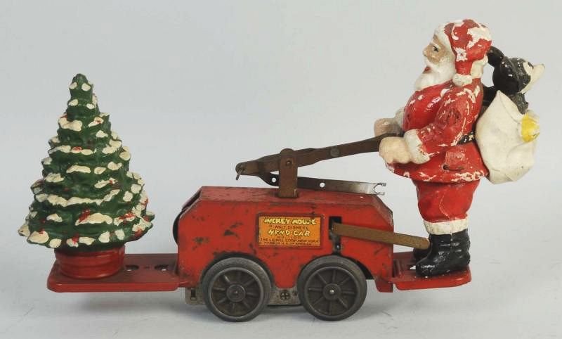 Lionel Mickey Mouse Santa Claus Handcar.: Not working. Needs to be put back together. Tree is completely restored. Santa Claus has some repainting and some chipping and wear. Condition (Good). Size 10 - 1/2" L.