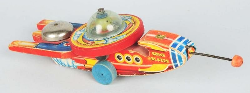 Early Fisher Price No. 750 Space Blazer Rocket.: Toy is all original. Does have some paper loss and wear throughout. Condition (Very Good). Size 12" L.
