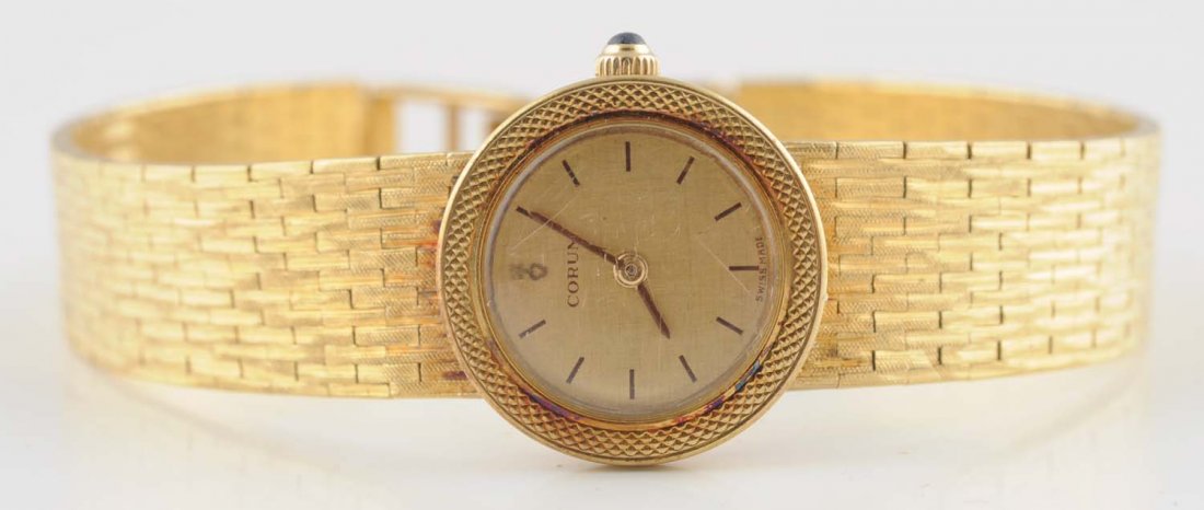 18K YG Corum Ladies Watch.: No.91031 23.8 dwt Condition (Excellent). Size 6 1/2