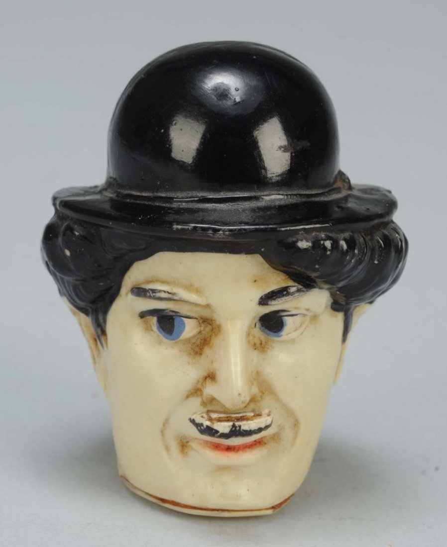 Rare Charlie Chaplain Figural Tape Measure.: Celluloid figure. Pull Charlie's moustache and tape extends. Full spring tape. Condition (Excellent). Size 2" T.