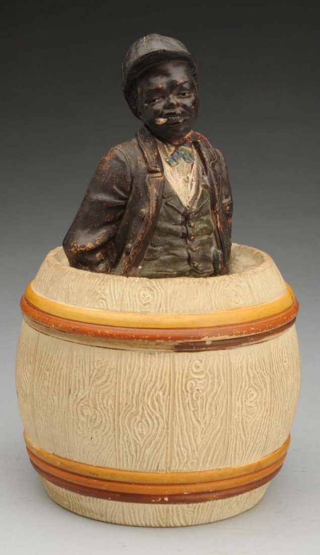 Johann Maresch Black Dandy Cigar Humidor.: Austrian. Art nouveau. Torso of a well dressed black man on top of a barrel which opens to hold tobacco. Wear to the painted glazes. Condition (Good). Size 9 - 1/2" T.