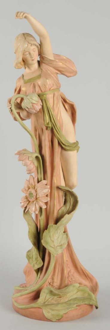 Large Porcelain Royal Dux Lady.: With flower. Milled base and arm. Factor made holes possibly to hold lamp. Old crack to arm. Condition (Excellent). Size 32 - 1/4" T.