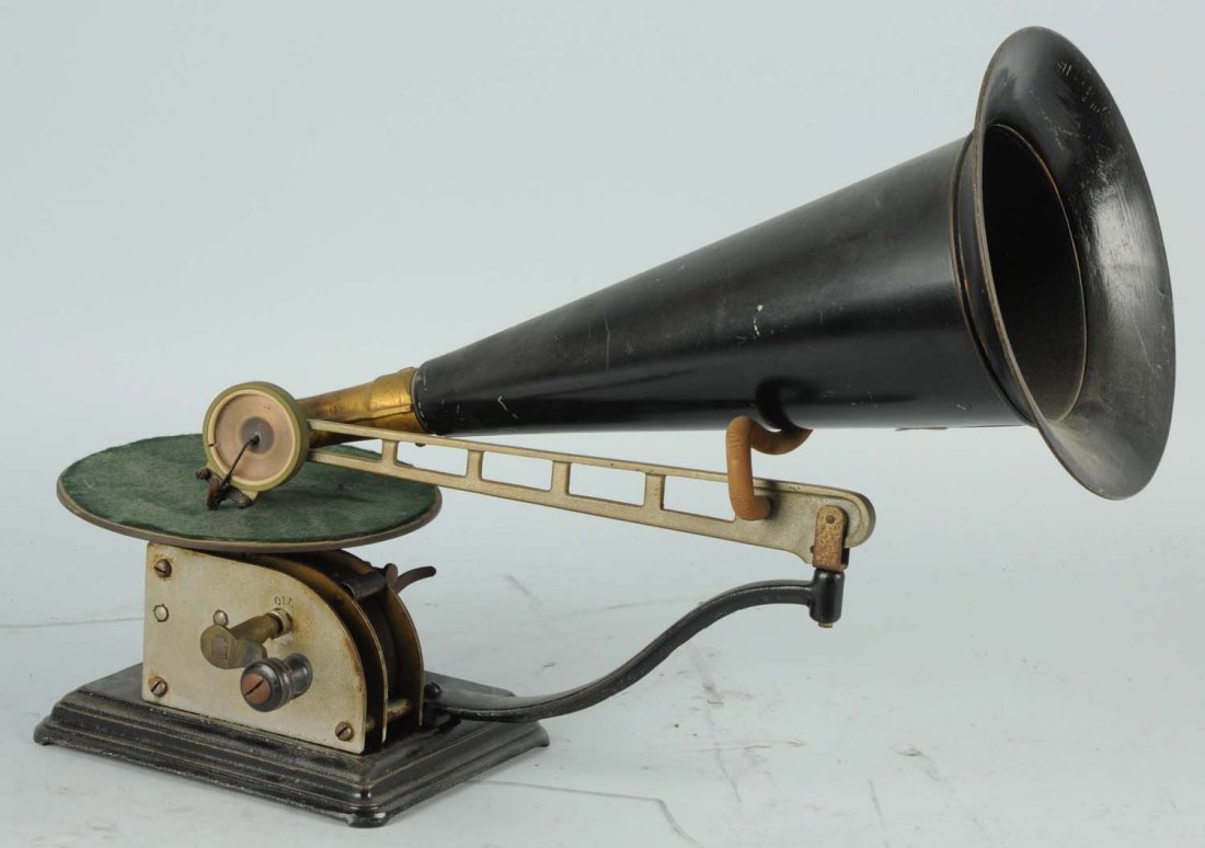 Small Phonograph with Horn.: Appears complete. Is for 7" records with horn. Condition (Excellent). Size 7 - 1/2" L.