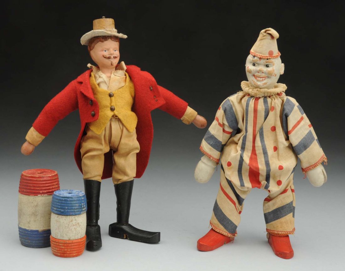 Lot of Schoenhut Items.: From the Humpty Dumpty circus, ringmaster with molded head and wood body, original clothing (light crazing and soil); clown (one ear missing, wear on face), original suit (light soil). Along with two 