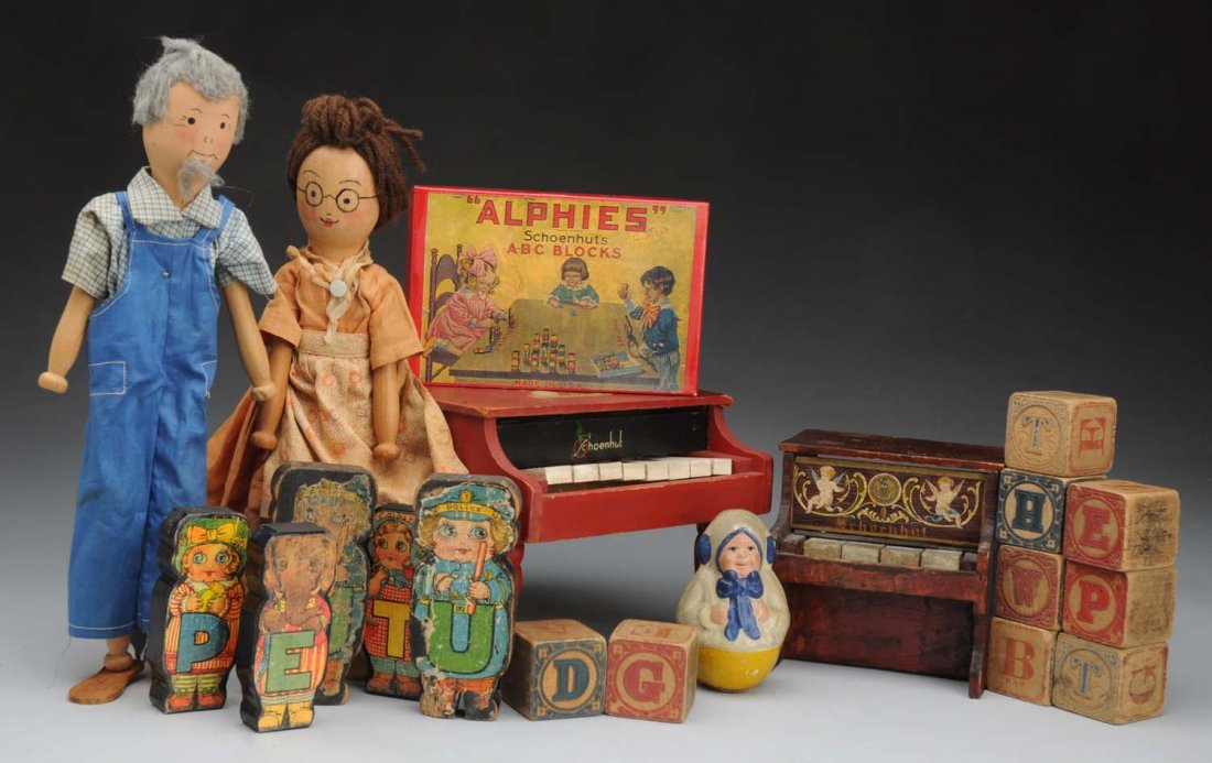 Lot of Schoenhut Toys.: Very nice Rolly Dolly with label (several tiny paint chips, dent on back of head), 2 Pinn Family Dolls in original clothing, small 4-key piano (paint wear, doesn’t work), red piano with 8 keys (some