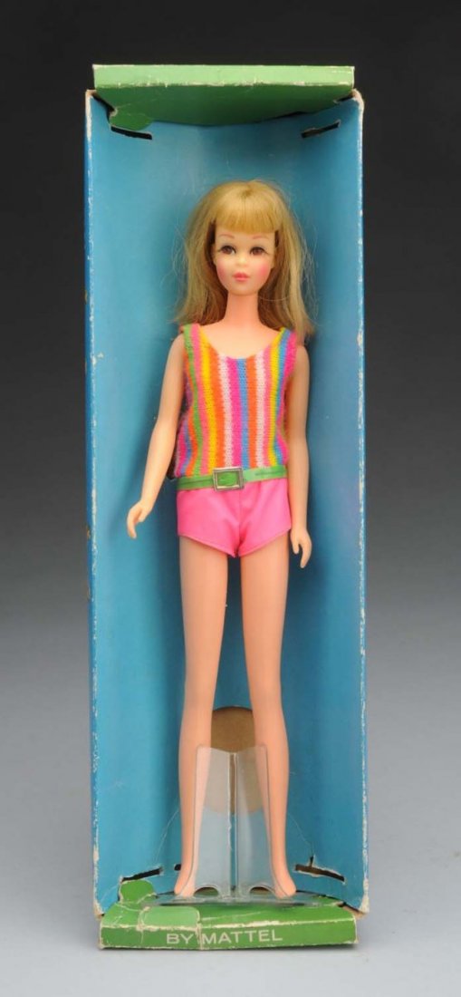 Twist-n-Turn Francie Doll.: With box. This twin 'n' turn Francie has blonde hair. Her swimsuit and original plastic stand are included. The box has minor wear overall. Doll (Excellent). Box (Very Good).
