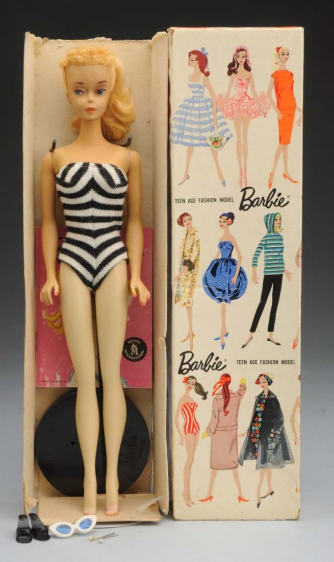 Blonde No.3 Ponytail Barbie Doll.: With box. This blonde No.3 Barbie has pink lips and red nails. There is a minor greening at the earring holes but it has no bleed out to the vinyl. There are no splits to the vinyl. This doll may be t