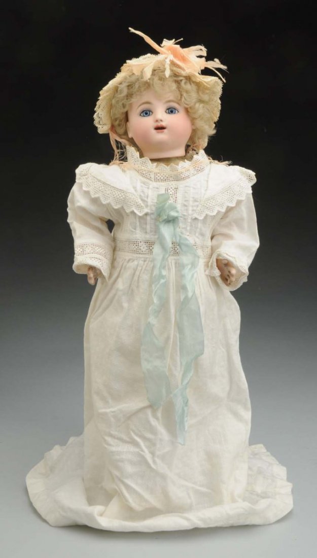 Lovely French Steiner Bébé Gigoteur.: Crying and kicking mechanical key wind doll by Jules Nicholas Steiner in working order with moving hands, legs and head; French bisque head with multistroked blonde eyebrows, inset blue paperweight ey