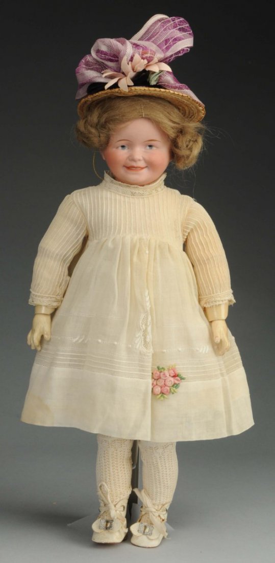 Sensational Character Doll.: German bisque socket head incised BP with green stamp of Swaine & Co. with intaglio eyes, molded eye sockets, tapered eyebrows, mouth with wide smile and painted teeth, philtrum, broad nose, vintage m