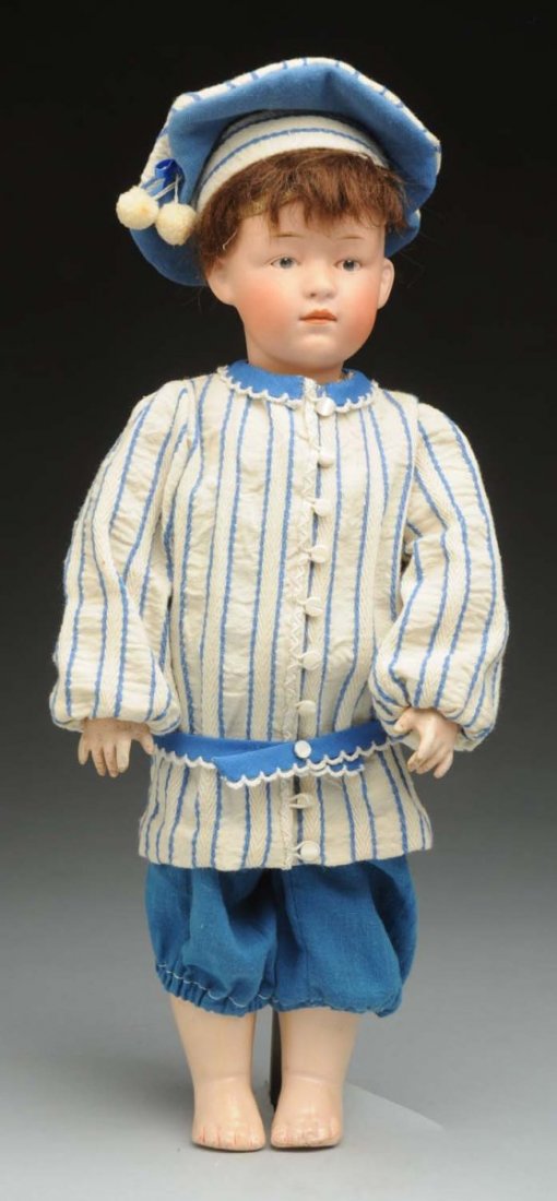 Pouty Heubach Character Child.: German pink bisque socket head mold 6971 by Gebruder Heubach, shaded eyebrows, intaglio eyes, molded eye sockets, white dot highlight, incised eyelids, closed mouth, rosy cheeks, original mohair wig;