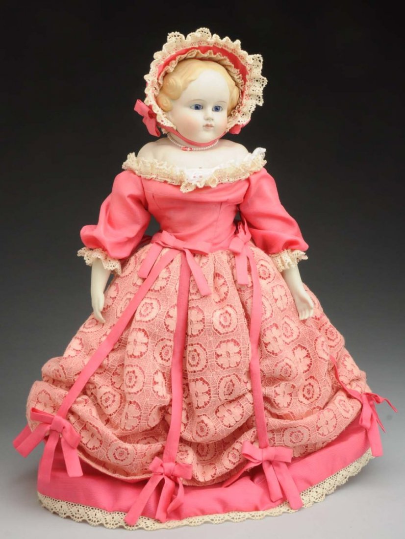 Remarkable Parian Child Doll.: Unmarked pale bisque shoulder head (tiny nose nick, short light red line on cheek, squiggly line and speckling on shoulder), with extraordinary anatomical molding on the shoulder plate, short neck wit
