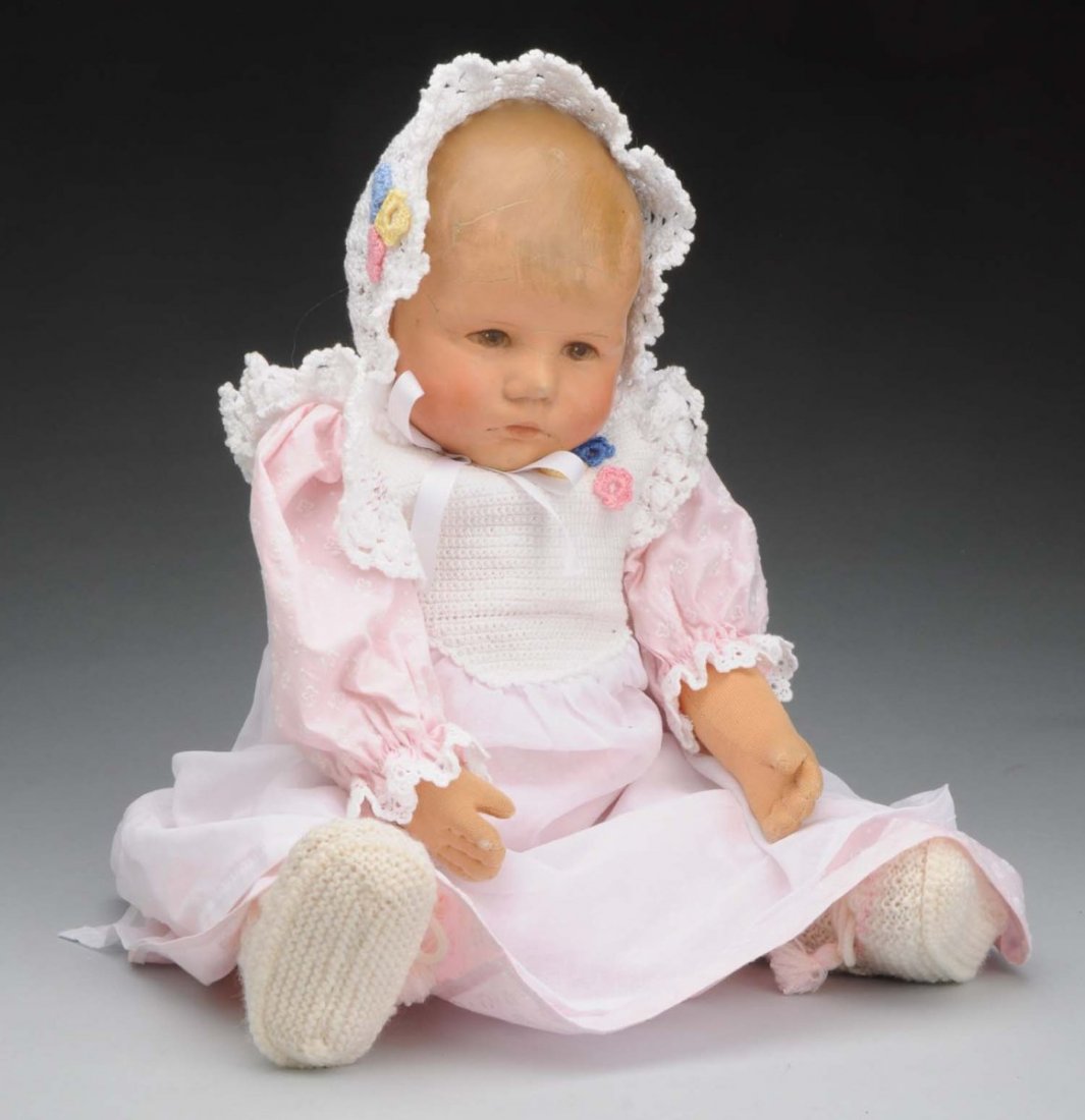 Lovable Kathe Kruse “Du Mein” Doll.: Weighted so-called “Sand Baby” with molded magnesit head (crazing on face) and open eyes, painted hair; stockinette body (light finger wear) with belly button and floppy legs. Some marks on foot b