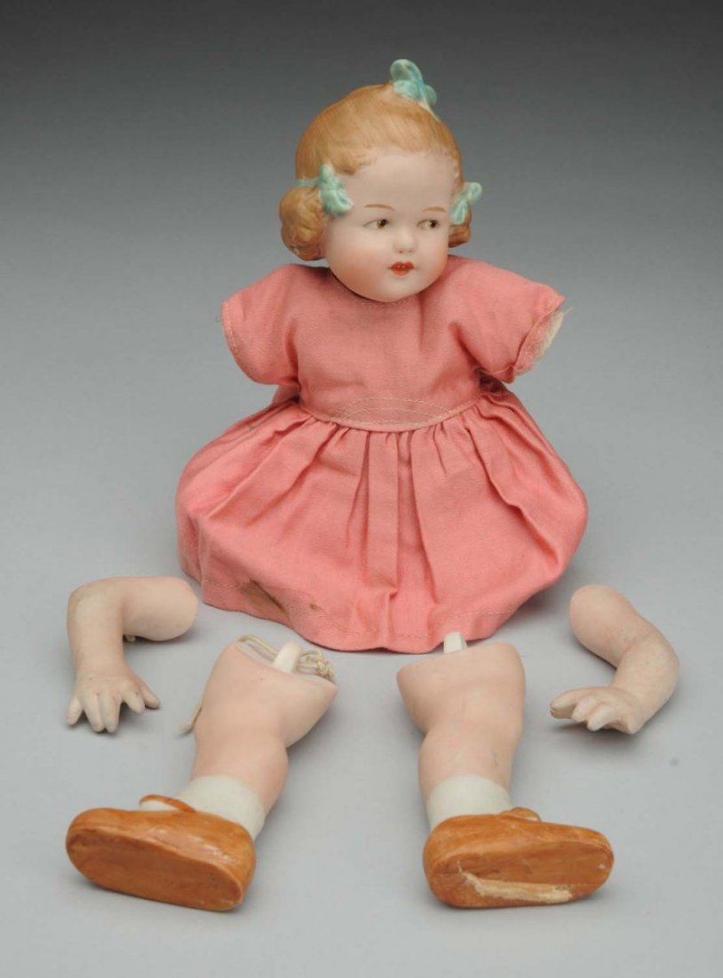 Saucy Heubach All-Bisque Girl.: Incised “10490” on torso, character face with three molded and glazed hair bows (firing ridge in the making runs from the right bow to under her chin), tapered eyebrows, intaglio side-glancing eye