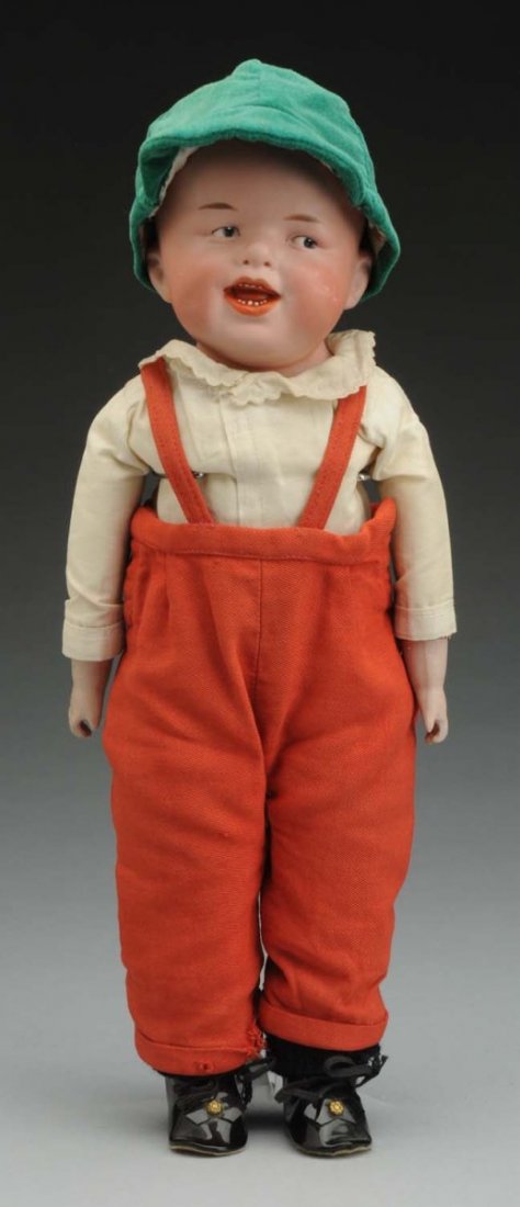Laughing Heubach Character Boy.: German bisque shoulder head incised with Gebr. Heubach square mark (cheek rubs), molded hair, tapered eyebrows, intaglio eyes with white dot highlight, open/closed mouth with molded tongue and painted