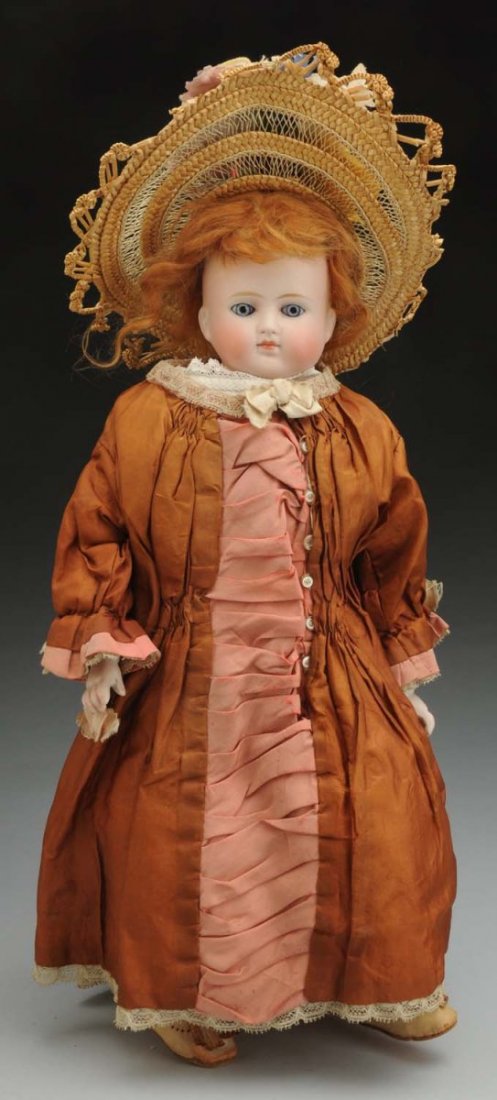 Lovely German Bisque Doll.: Turned shoulder head probably by Alt, Beck & Gottschalck with bald head, feathered eyebrows, stationary blue glass eyes, painted lashes, closed mouth with lip shading strokes, chin dimple, strawberry 