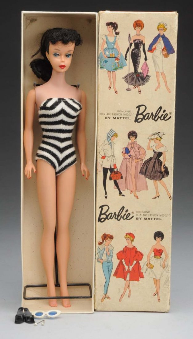 Brunette No.5 Ponytail Barbie Doll.: With box. This brunette Barbie has red lips and nails. There is no greening to the ears and no splits to the vinyl. Her swimsuit, shoes, sunglasses, and stand are included. The box lid has two split c
