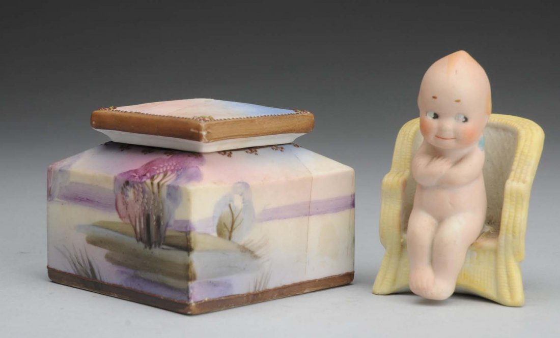 Lot of 2: Japanese Items.: All bisque Kewpie Governor sitting in chair (broken from chair, needs to be glued, and needs cleaning) and hand-painted Nippon Morimura dresser jar. Condition (Very Good). Size 3" T.