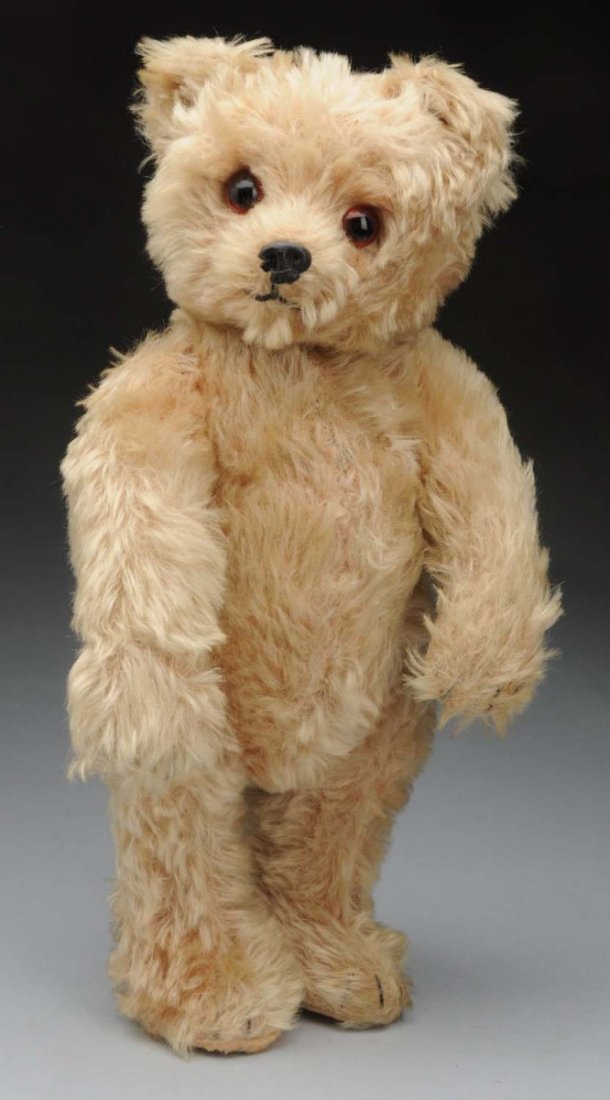 Schuco Yes/No Teddy Bear.: Lovely long mohair (some loss on front torso, piece off nose), large brown eyes, stitched mouth and claws (paw pad repaired), tails moves head to indicate “No” but he doesn’t want to say “Yes.