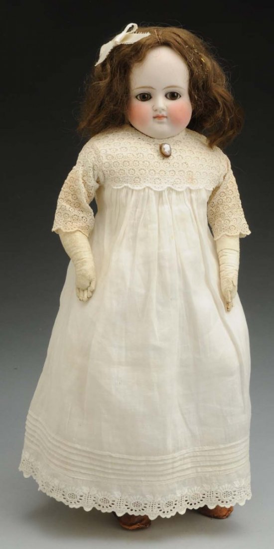 Sweet German Bisque Child Doll.: Unmarked turned bisque shoulder had, but likely by Alt, Beck & Gottschalck, with feathered eebrows, set brown eyes, painted upper and lower lashes, closed mouth with lip shading line, replaced brown w