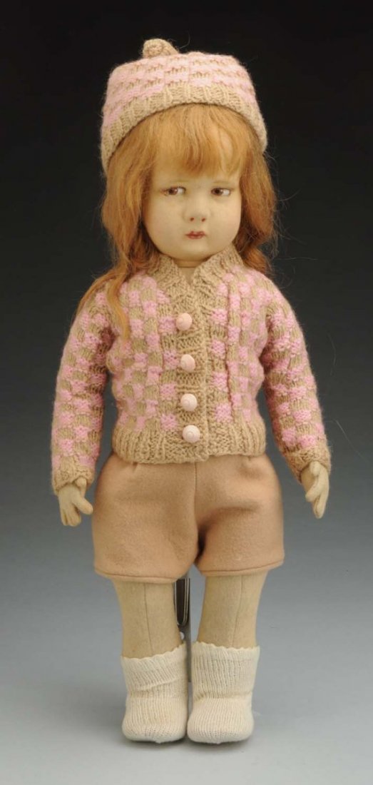 Sweet Lenci Cloth Doll.: All felt with pouty face, dramatic brown painted eyes, closed mouth (lips touched up, face faded, light dust overall), original long mohair wig with bangs; jointed shoulders and hips; felt pants and s