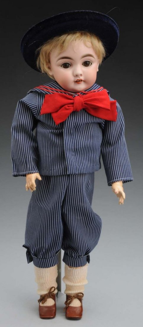 Darling Kestner Child Doll.: German bisque socket head incised “G made in Germany 11 143” with multistroked eyebrows, sleeping eyes, painted lashes, original bobbed mohair wig, open mouth with two upper teeth; original Kestne