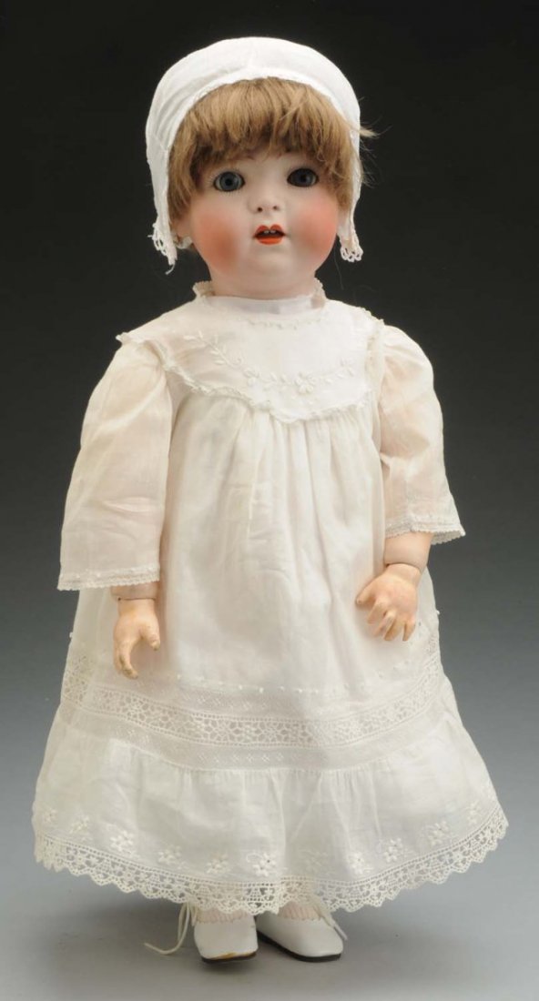 Chubby Toddler Doll.: German bisque socket head incised “1295 F.S.&Co. Made in Germany” by Franz Schmidt & Co. with multistroked eyebrows, sleeping eyes, painted upper and lower lashes, pierced nostrils, open mouth wit