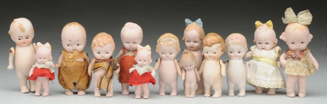 Lot of 13: All Bisque Dolls.: Variety of German Hertwig character dolls, some with original clothing, with jointed shoulders. Instant collection of these darlings! Condition (Very Good). Size Tallest 3".