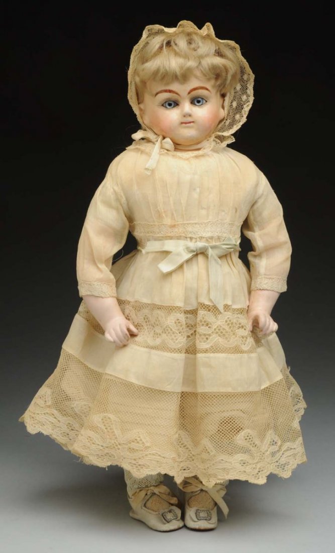 Charming Papier-Mâché Child Doll.: Shoulder head with feathered eyebrows, blue paperweight eyes, painted upper and lower eyelashes, antique blonde mohair wig, closed mouth (light scuffing on face, paint wear on lips), kid body (short s