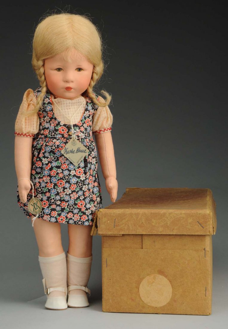 Fantastic Kathe Kruse "Hampelchen" Doll: All cloth Doll XII H after a model by Igor von Jakimow with painted features, original human hair wig with braids; cloth body with dangling legs and button on back; Kathe Kruse signature on foot. Comp