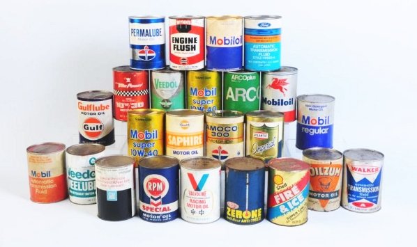 Lot of Assorted Oil Cans.: Box lot of one quart oil cans. Mixture of metal and composite cans. All cans are full. Condition (Fair - Good). Size Each: 5 - 1/2" T.