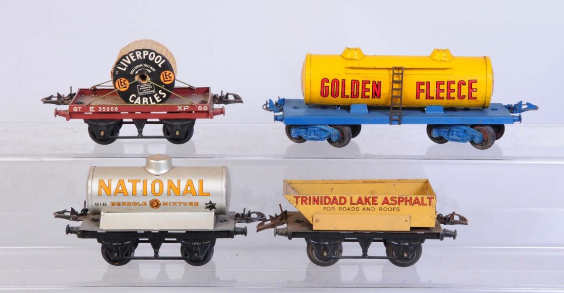 Lot of 4: Hornby Assorted Freight Cars.: Lot includes on Golden Fleece tank car. Has some scratches in very good condition. One National tank car. Could be cleaned to a better grade. One Trinidad Lake Asphalt could clean to a better grade. A