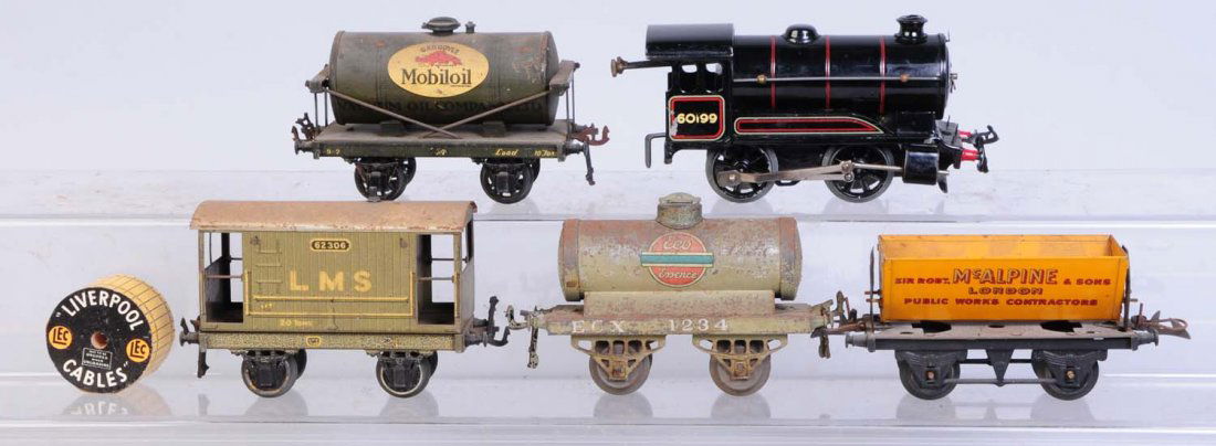 Hornby Locomotive & 4 Freight Cars.: Hornby 0-4-0 steam locomotive wind-up no key. Complete and all original. Basset Lowke Four wheel mobile oil tank car. Has scratches. Eco tank car significant paint loss. Basset Lowke brakeman car. Has