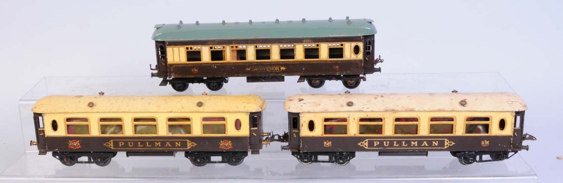 Hornby O Gauge Grosvenor.: Three pullman car scratched and worn paint. Condition (Good).