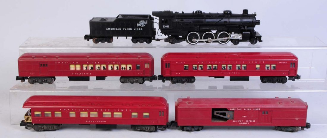 American Flyer 21085 Steam Engine & 4 Cars.: Red passenger cars. No.21085 steam locomotive and tender. Pike master trucks. Clean and attractive. Complete. No.918 operating Railway Express baggage car. Has some spots of rust on the mechanism. No.