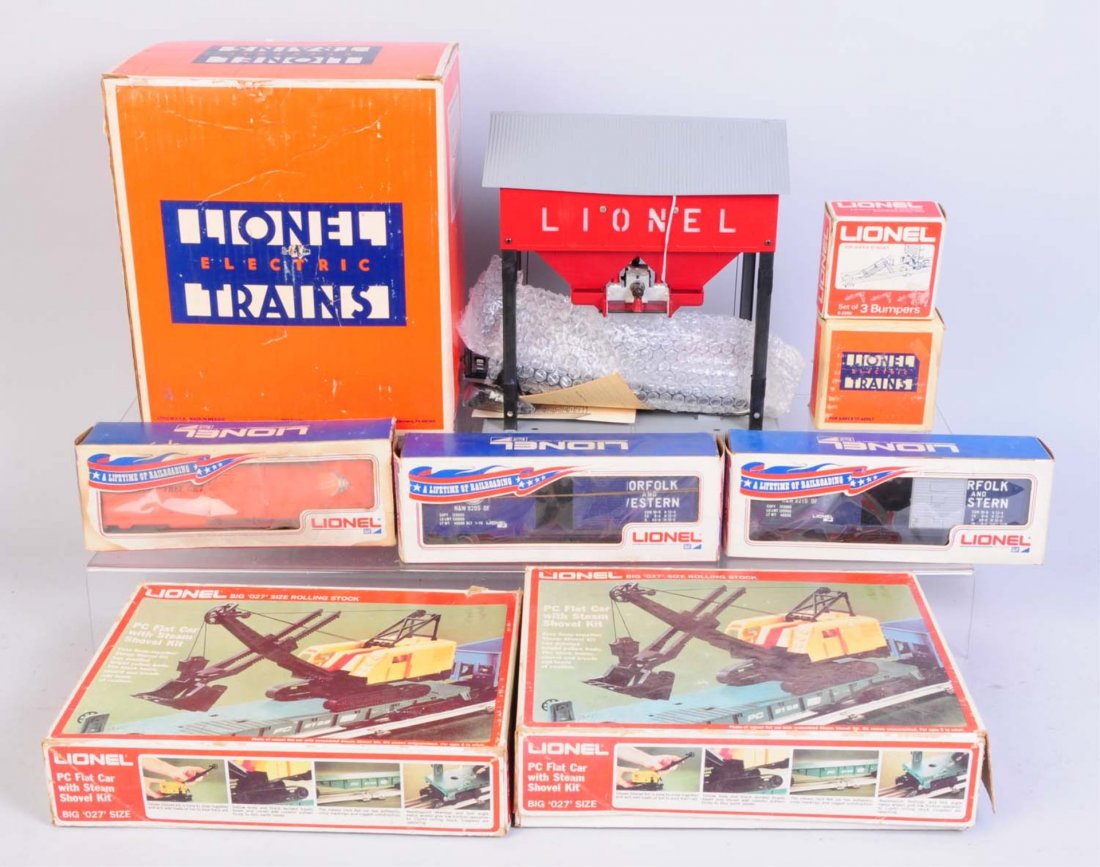 Lionel Assorted Freight Cars & Accessories.: Modern era. No.2315 operating coaling station. Has controller. Complete and in excellent condition. No.6464-500 orange Lionel NPC box car. Has some rust on coupler weights. Uncommon car. No.9205 N&W b