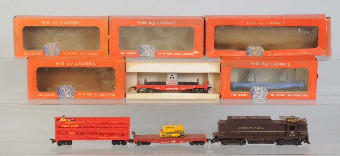 Lionel Assorted HO Scale Trains.: No.0581 Pennsylvania Railroad EP5 electric. Complete and in original box. Tattered and torn box. No.0805 Seabord radioactive flat car in original box. Box is dirty and stained. Has some corrosion on t