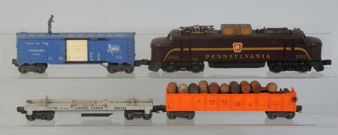 Lionel No.2352 PRR EP-5 with Freight Cars.: Locomotive is complete and all original. Some rust on the pantographs. Frame looks good no rust on trucks. Nice original shell. No.3361-25 dump car missing the bin. Has rust on frame and trucks. No.34