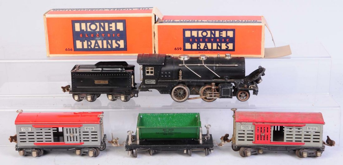 Lionel No.261E Pre-war Locomotive & Freights.: Includes No.261 steam locomotive. Broken pilot. Broken steam chest, missing rear truck, rusty side rods and missing some side rods. Broken boiler front. Nice paint on boiler. Black nickel trim. No.262