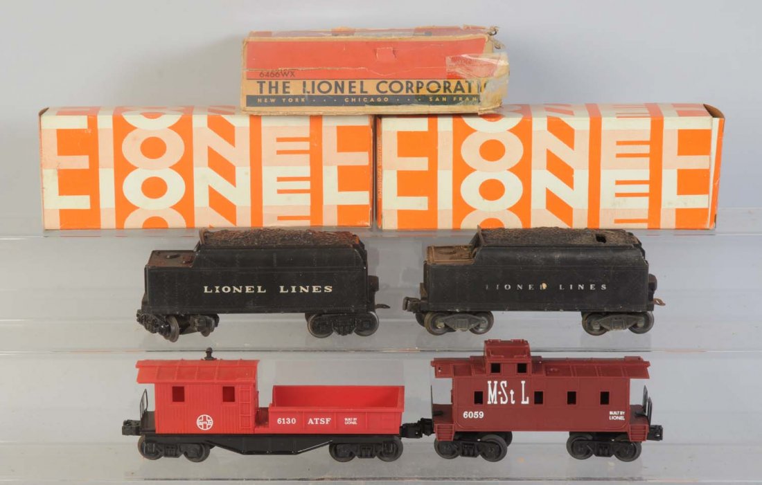 Lionel No.6131 Caboose, 6057 Caboose & 2 Tenders.: No.6130 Santa Fe work caboose is complete in original box. Will come to you in a Hagerstown box. Corrosion on axles otherwise in like new condition. No.6057 Hagerstown box only. Good, square uncommon 
